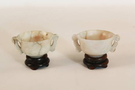A Pair of Chinese Jade Cups with Side Handles: A Pair of Chinese Jade Cups with side handles. Diameter 2.5" Height 2" (with stand)
