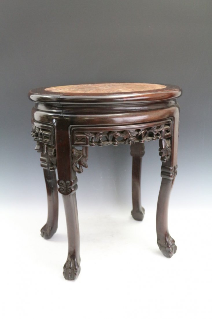 Rosewood Oval-shaped Stool: Rosewood Oval-shaped Stool with scrolling feet. Width 17.5" Depth 13.75" Height 20.5"