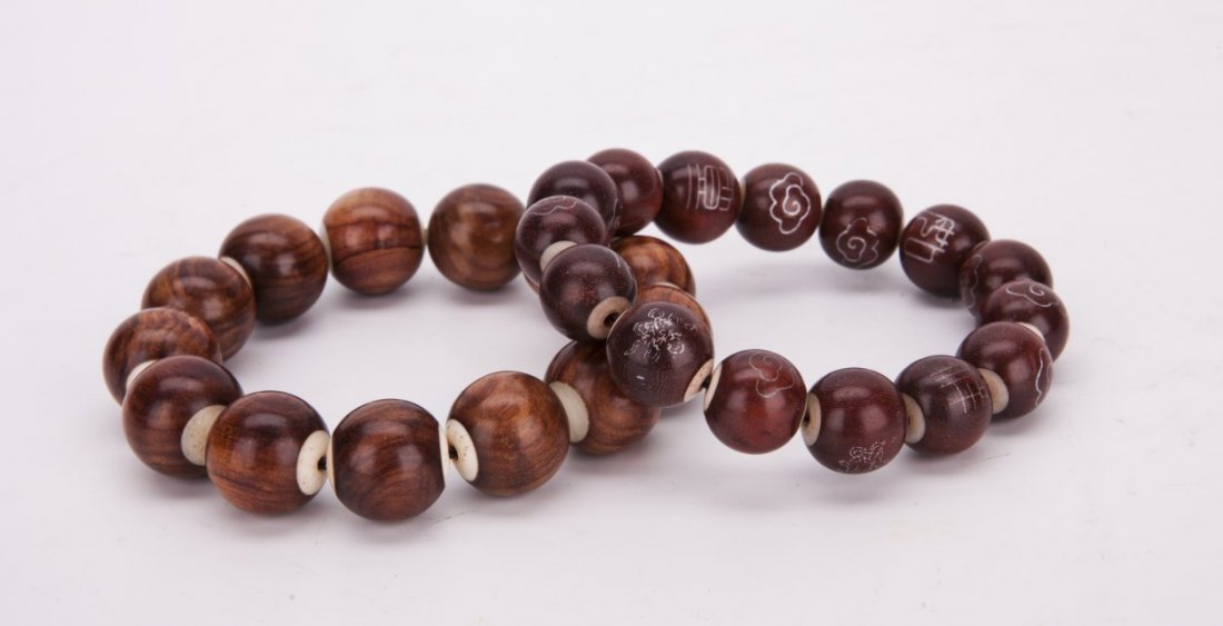 Two Chinese Huanghuali Bead Bracelets: Two Chinese Huanghuali Bead Bracelets with ancient characters and patterns silver inscription (12 beads & 13 beads)