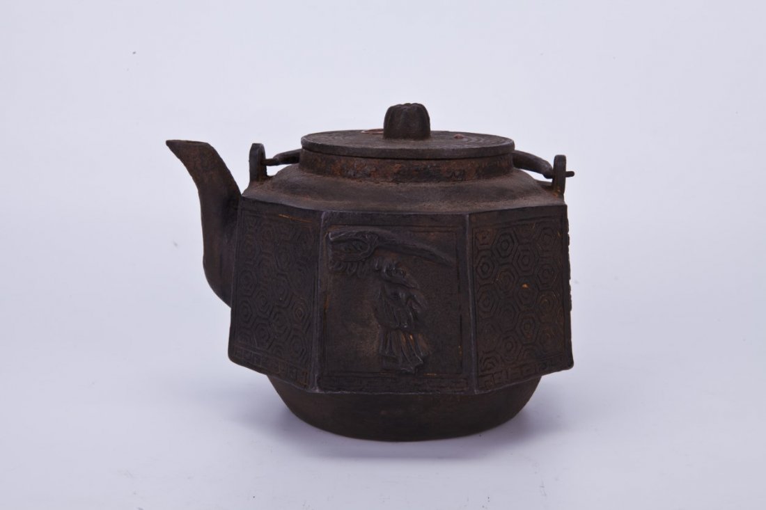 Japanese Cast Iron Octagon Shaped Teapot: Japanese Cast Iron Octagon Shaped Teapot, the exterior is decorated with images of birds and an old man, with Qianlong mark.Length 5.5" Width 7" Height 5.5"