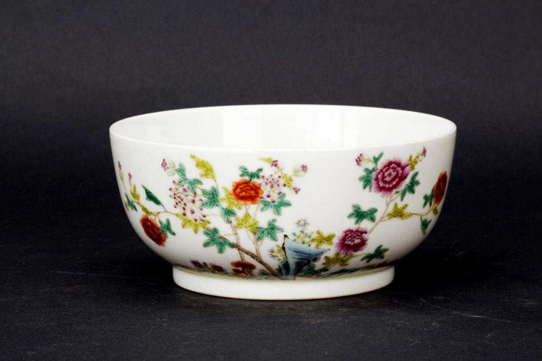 Famille Rose enameled porcelain bowl: Famille Rose enameled porcelain bowl with the design of rose garden landscape to the front and Chinese calligraphy to back of the bowl, seal mark. Diameter 6" Height 2.75"