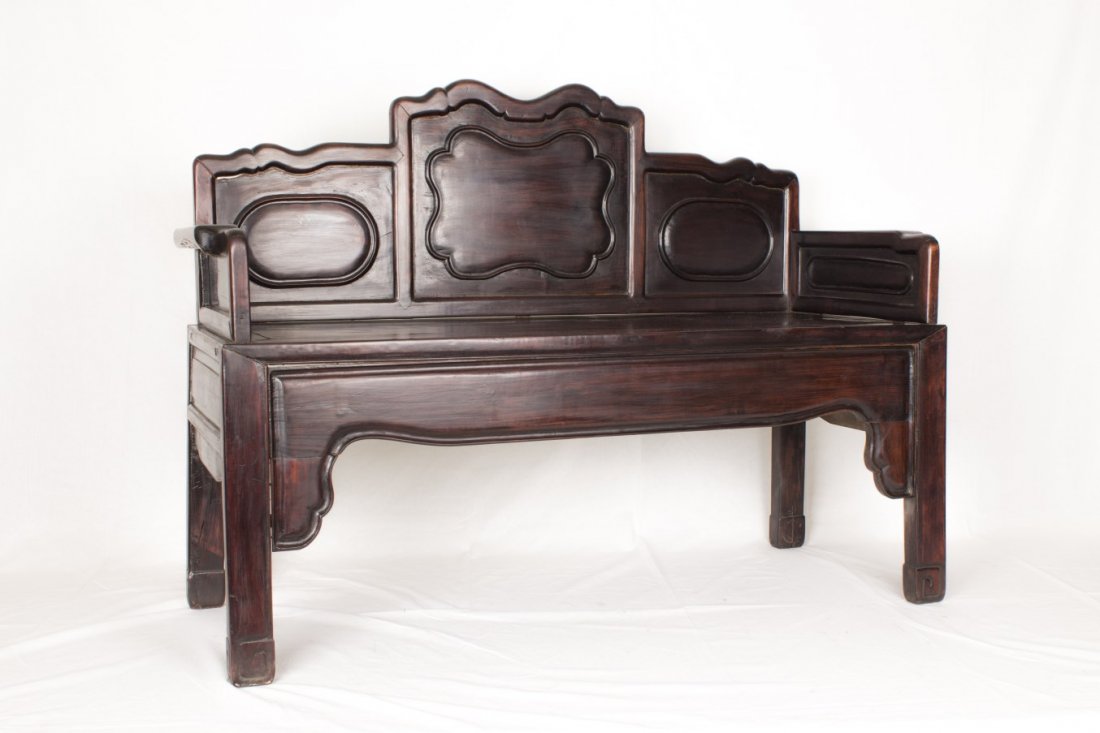 Chinese rosewood settee: Chinese rosewood settee, 19th/20th century, the base with recessed seat supporting three back panels inset and pair of wood armrests to the sides, the apron and sqandrels to the front. Length 51.25" W