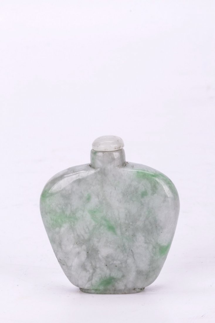 Natural Green and White Jadeite Snuff Bottle: Natural Green and White Jadeite Snuff bottle, compressed fan-shaped with round edge, with light suffusion sand translucent white cap. Length 2" Height 2"