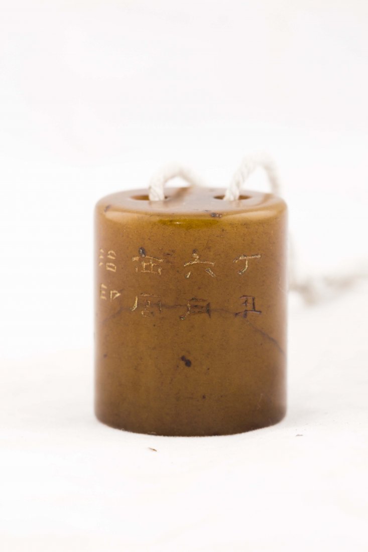 A Chinese Tian Huang Soapstone Seal: A Chinese Tian Huang Soapstone seal of cylinder form, carving the characters of Landmarks, June, Xi Tang. Wearable condition with drilled hole for the string strung. Length 1" Height 1.25"