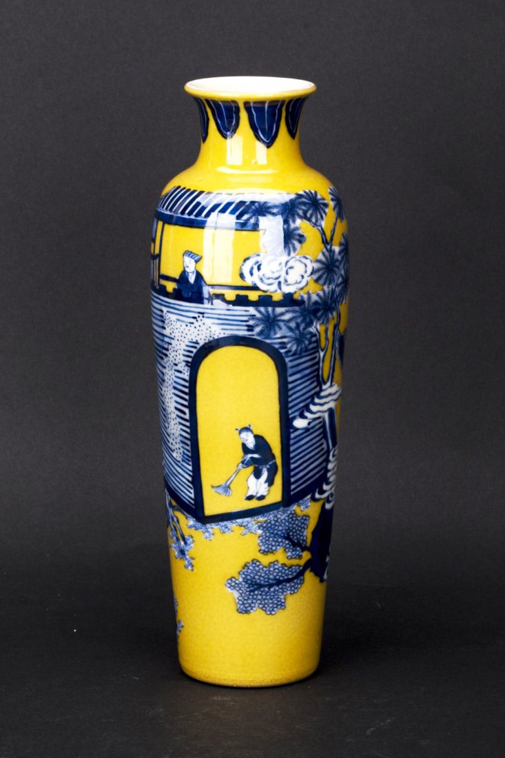 A Republic Chinese Porcelain vase: A Republic Chinese Porcelain vase with a slender cylindrical shape in vibrant yellow and blue glazed, hand painted blue and white ancient characters and architectural setting. Diameter 3.5" Height 10.