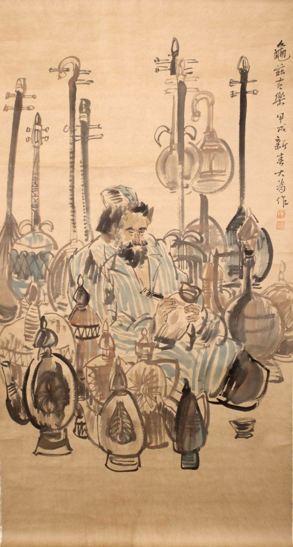 Chinese Scroll Painting: Chinese scroll ink and color on paper painting, depicting a seated ancient man surrounded by several Kucha instruments, signature after Liu Dawei. Length 69" Width 37"