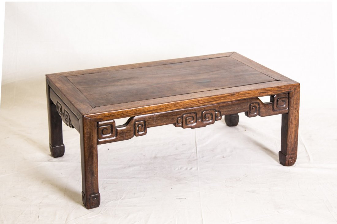 Chinese Hardwood Kang Table: Chinese carved hardwood rectangular low table supported by four hoof like feet. Length 28" Width 16.25" Height 11"