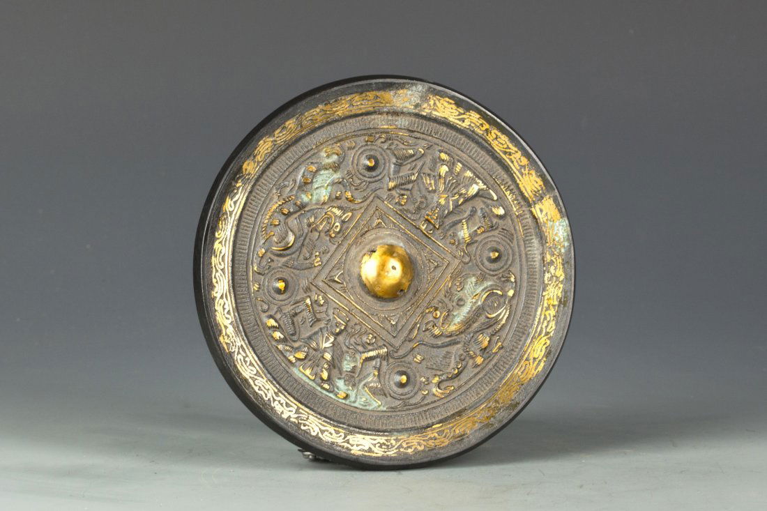 A group of four Chinese bronze mirrors: Four pieces of Round shape Chinese Bronze Mirror with different size and different pattern. (1)Diameter 6.75" Height 0.5" (2)Diameter 4.25" Height 0.25" (3)Diameter 4" Height <0.25" (4)Diameter 3" Hei