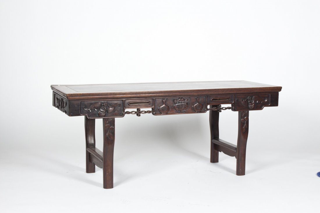 Chinese Hardwood Tea Table: Chinese Hardwood Tea Table with straight legs and finely hollowed. The pattern is of bat and peach. Length 49.25" Width 17" Height 20"