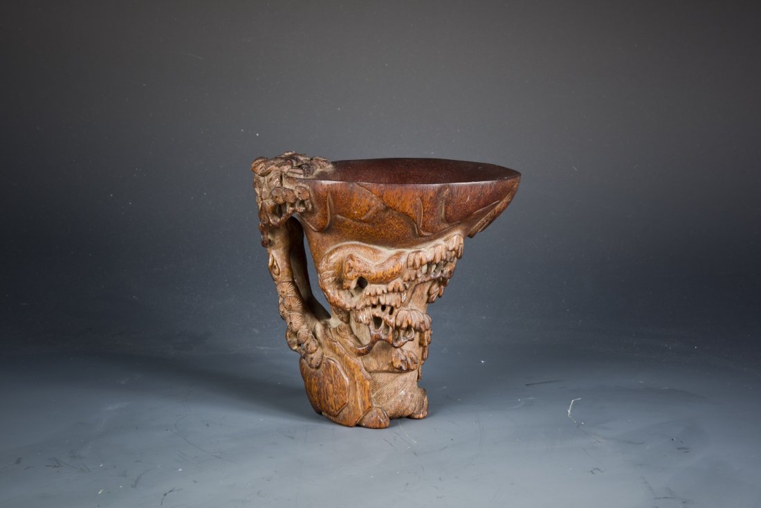 Ox-horn-Carved Wine Cup: A Fine ox-horn cup carved with horses, pine trees, etc. Length 4.75'' Width 3.75'' Height 4.5''