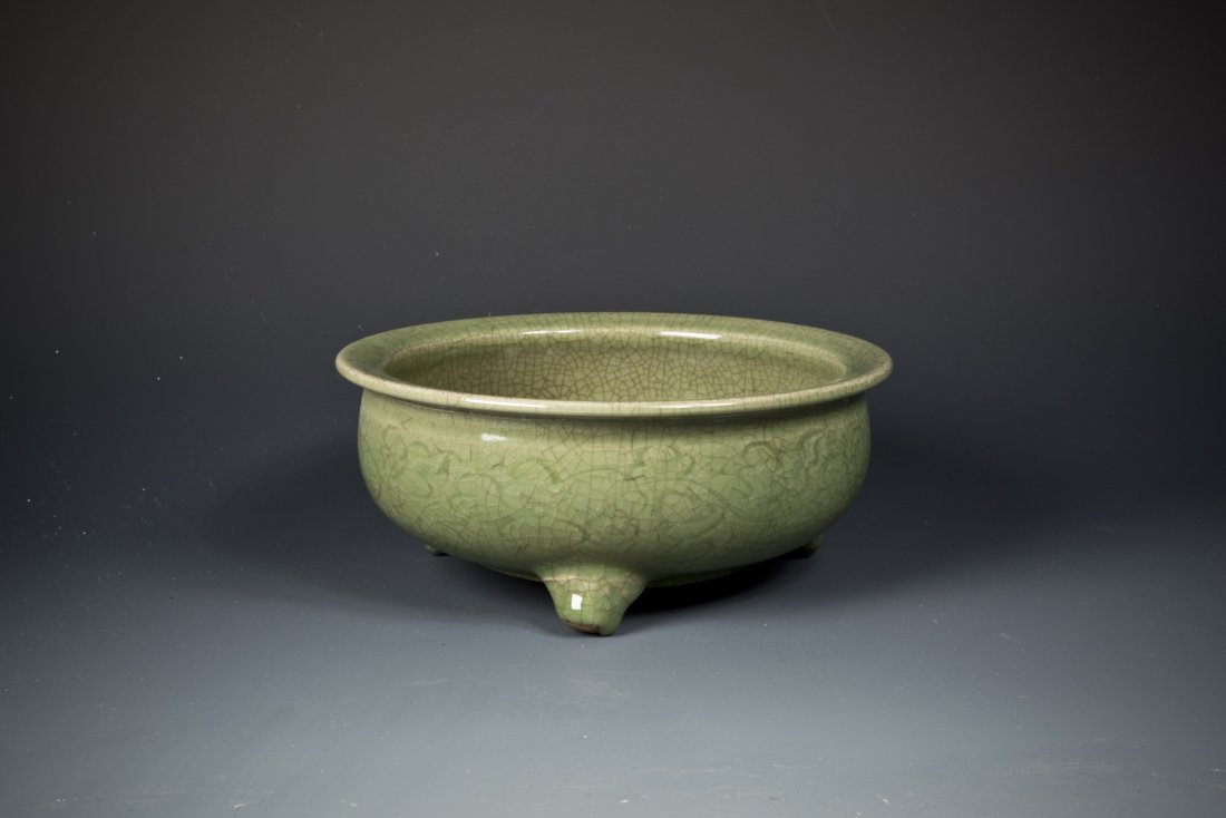 Porcelain Tripod Celadon Brush Washer: A Fine Porcelain Tripod Celadon Brush Washer covered with natural cracking pattern and decorated with floral pattern along the exterior. Diameter 8.375'' Height 3.5''