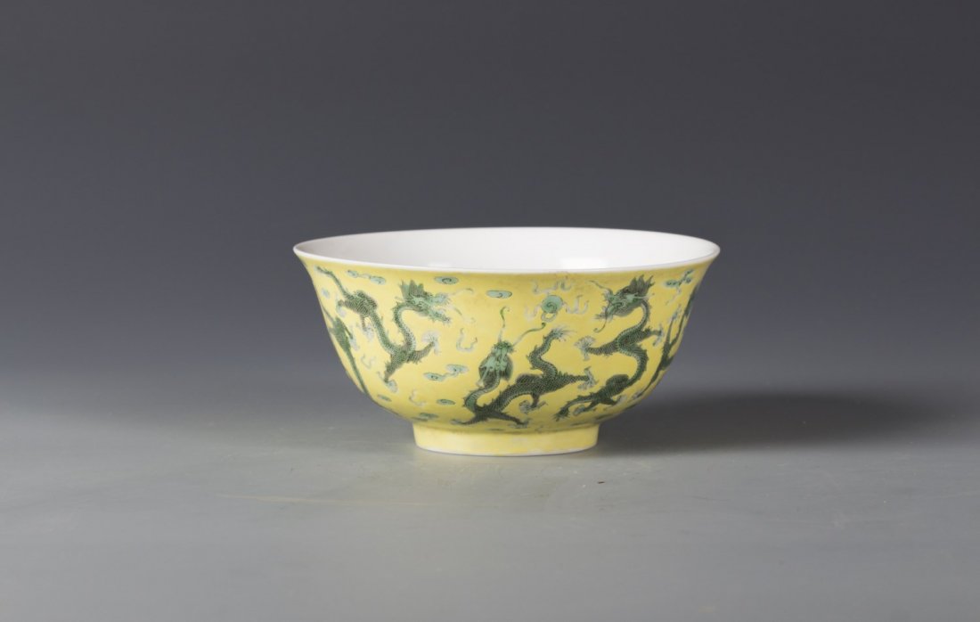 Chinese Yellow Glazed Porcelain Bowl: Chinese Yellow Ground Glaze Porcelain Bowl, painted enameled green dragons to exterior over the yellow ground. Mark with six calligraphy character of Dao Guang on the bottom. Diameter 6.25" Height 2.7
