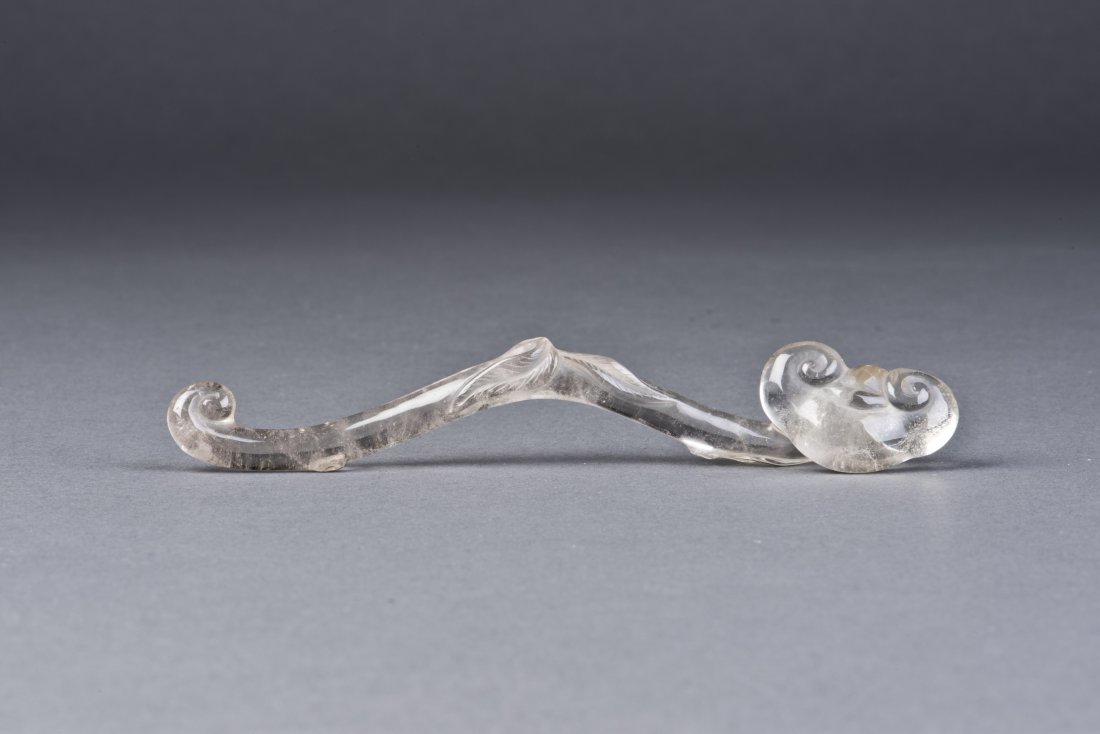 Crystal Brush Ruyi Scepter: Crystal Brush Ruyi Scepter with a raised section in the center. The transparent even tone and the fluent shape contribute to the divine look. Diameter 0.75'' Height 5.5''