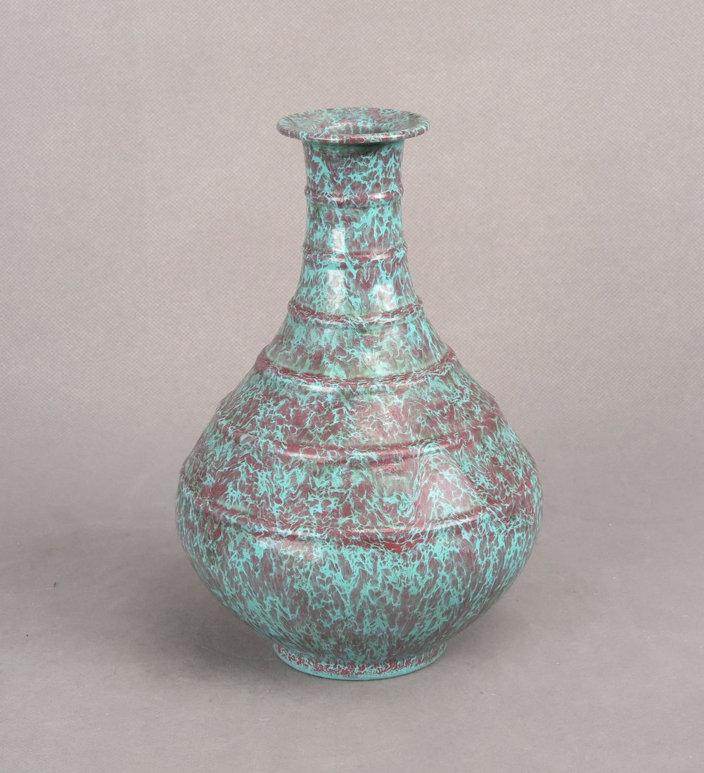 A CHINESE 'ROBIN'S EGG'-JUN-GLAZED PORCELAIN ZUN VESSEL: A Chinese Lu Jun(Robin's Egg)-glazed porcelain Zun vessel with a rounded body rising to a narrow neck with gently everted rim, all covered in a marbled glaze of bright turquoise and deeper violet, the