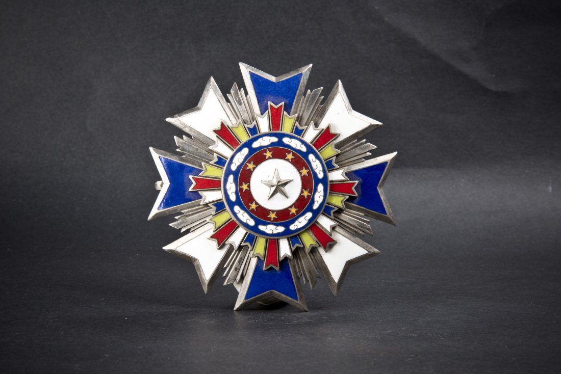 OCTAGON SILVER MEDAL: A Chinese Antique Octagon Silver Medal with pin and seal on the back. Diameter 3.5''