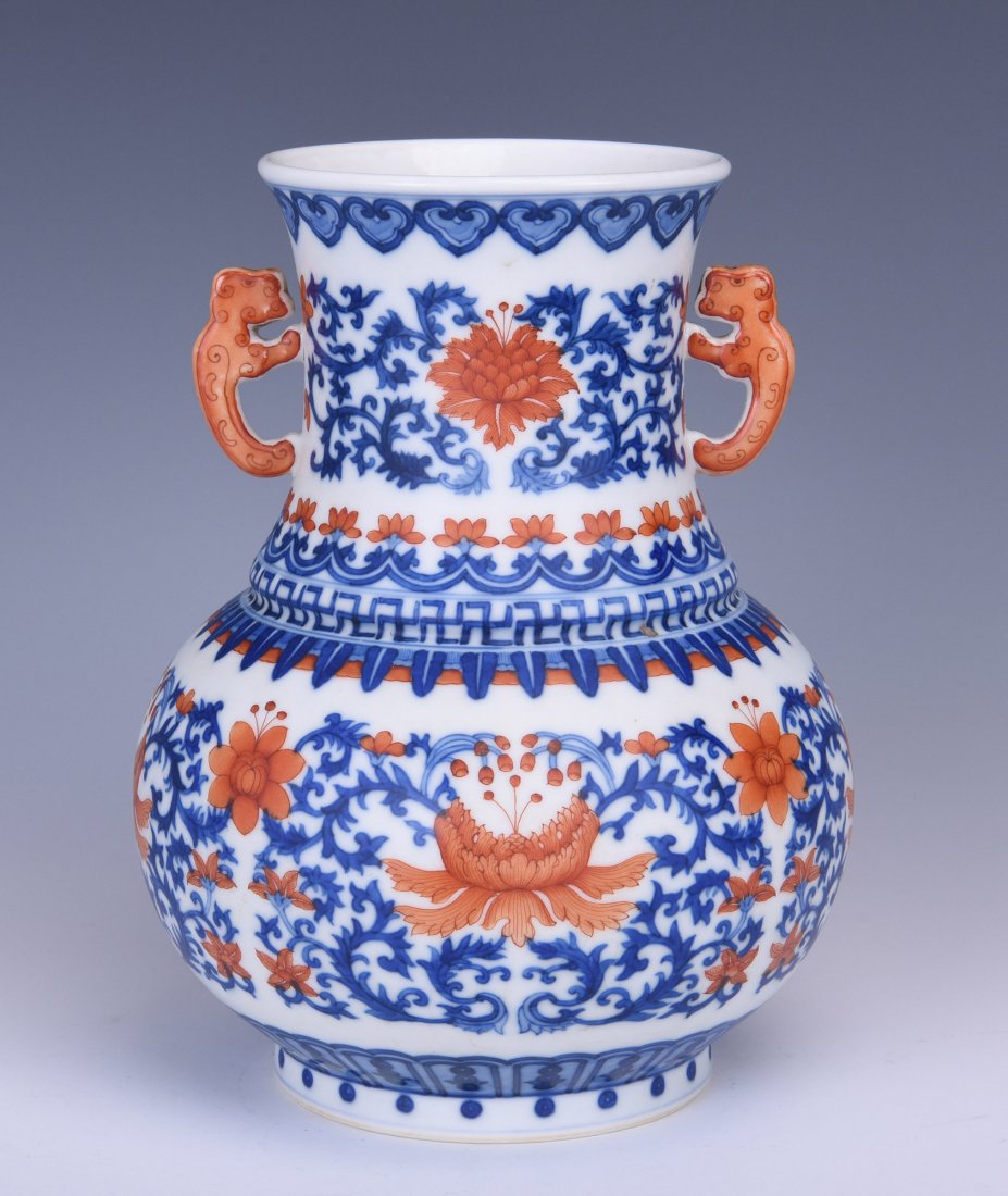 AN IRON-RED DECORATED BLUE AND WHITE PORCELAIN ZUN (1 of 9)