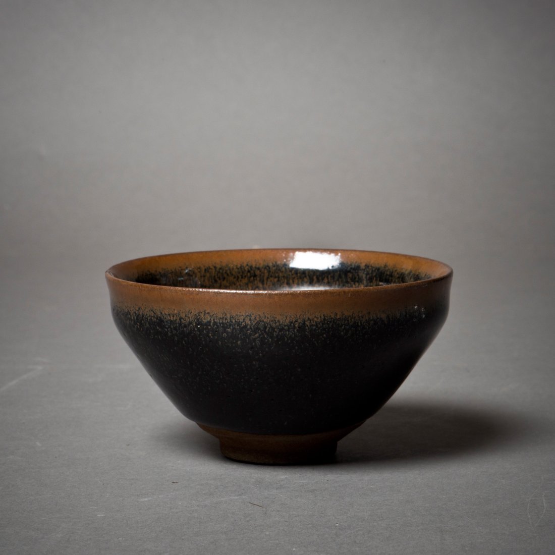 A CHINESE BLACK -GLAZED BOWL (1 of 3)