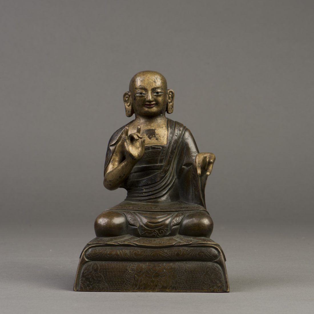 A GILT BRONZE SCULPTURE OF BUDDHA (1 of 6)