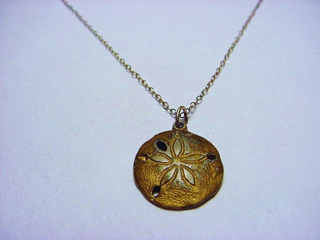 STERLING SAND DOLLAR NECKLACE: STERLING SAND DOLLAR NECKLACE