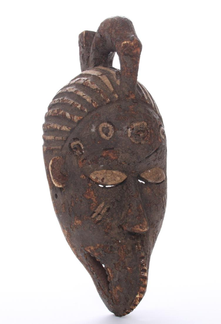 Antique African wood mask, Republic of Congo.: Antique African wood mask, Republic of Congo. Estimated more than 50 yrs old. African art is a term typically used for the art of Sub-Saharan Africa. A few of the most popular traditional African art 