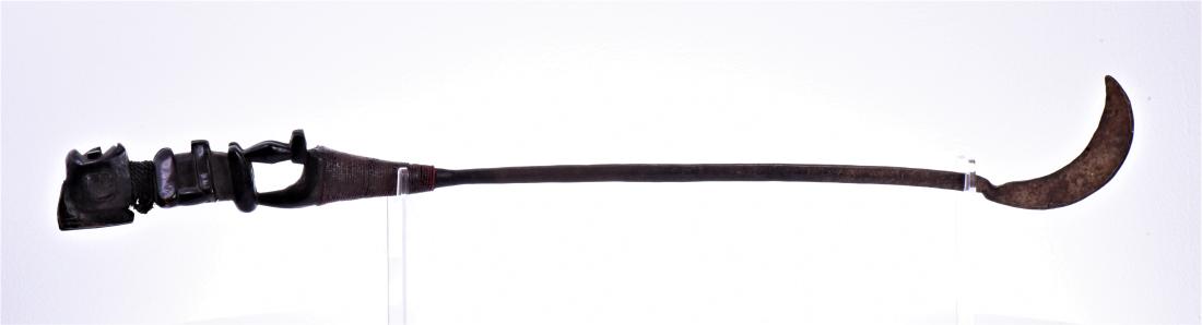 West African Steel Sickle With Carved Wood An: West African Steel Sickle With Carved Wood And Beaded Handle. Size: 35 in x 5 in. Estimated more than 100 yrs old. African art is a term typically used for the art of Sub-Saharan Africa. A few of the