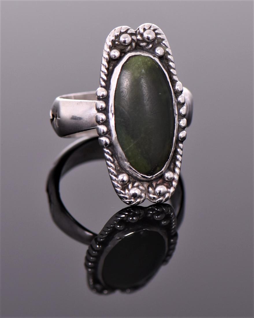 Central American Sterling Silver Ring With Mo: Central American Sterling Silver Ring With Mottled Green Stone Center Signed With Silversmith Starburst Hallmark And Beautiful Craftsmanship Of Drip work and Roping. Ring Size 15. Estimated more than 