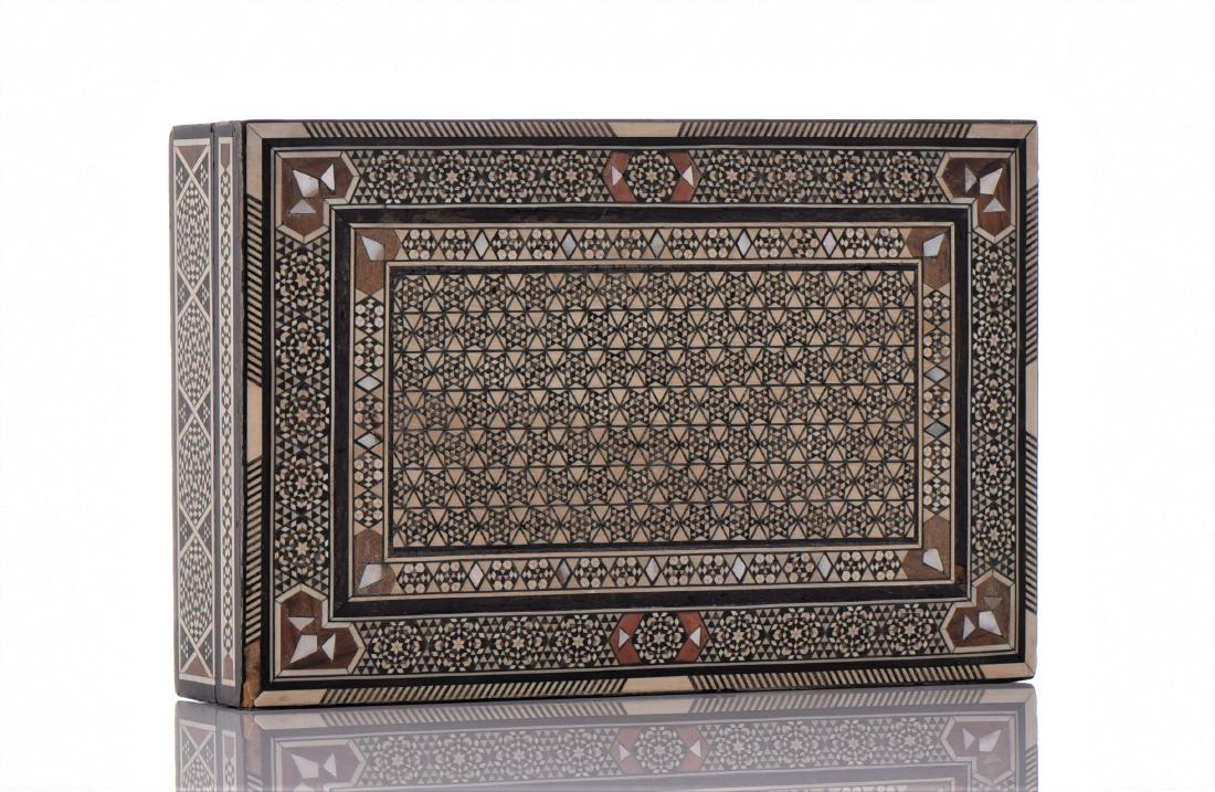 A Fine Syrian inlaid hand made marquetry micro mos: A Fine Syrian inlaid hand made marquetry micro mosaic jewelry box. Inlaid with Mother of Pearl, Bone, and lined with a maroon red velvet interior. Estimated more than 75 yrs. old. Islamic art encompas