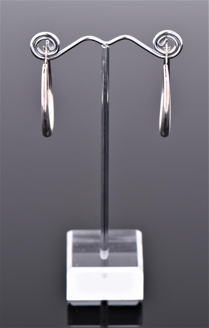 Tiffany and Co. Sterling Silver open teardrop earri: Tiffany and Co. Sterling Silver open teardrop earrings. Signed Elsa Peretti Estimated less than 50 yrs. old. Size and/or Weight: See Measurement Photo. (Photos Represent The Lot Condition, Pangaea Auc