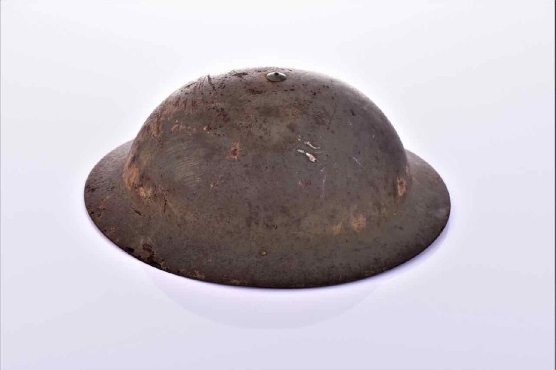 WW1 Infantry Helmet. Possibly US Doughboy or: WW1 Infantry Helmet. Possibly US Doughboy or French Infantry. Estimated more than 75 yrs old. Size and/or Weight: See Measurement Photo. (Photos Represent The Lot Condition. Read T&C's)