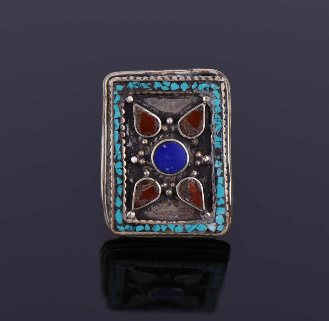 Tibetan Silver Turquoise And Carnelian Ring.: Tibetan Silver Turquoise And Carnelian Ring. Ring Size 9. Estimated more than 50 yrs old. Tibetan silver is used primarily in jewelry components, and is similar to pewter - an alloy of copper, and som