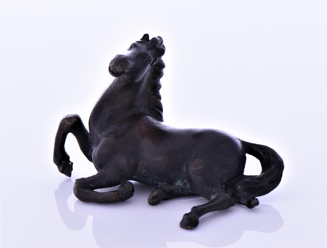 Antique Chinese Bronze Sculpture: Antique Chinese Bronze Sculpture of a Fallen Horse. Estimated more than 100 yrs old. Chinese art is visual art that, whether ancient or modern. Early "stone age art" dates back to 10,000 BC, mostly co