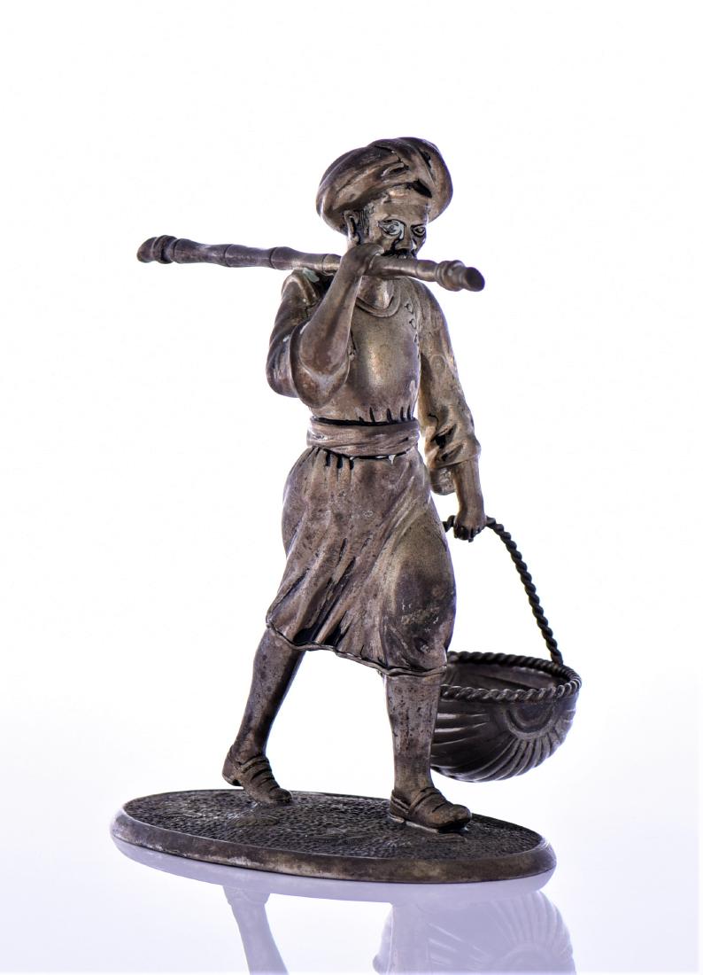Brass Sculpture Of An Indian Farmer Hold: Brass Sculpture of An Indian Farmer holding a long cane and basket. Estimated more than 75 yrs old. Indian art consists of a variety of forms, including pottery, sculpture, paintings, and textiles. Ge