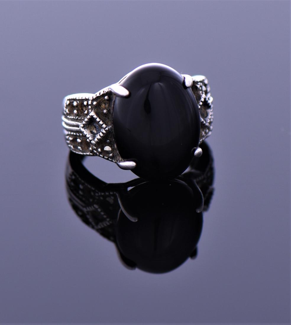 Black Onyx And Marcasite Sterling Silver: Black Onyx And Marcasite Sterling Silver Ring. Ring Size 5. Condition Report: missing some stones. Estimated more than 50 yrs old. 925 Sterling Silver consisting of 92.5% silver and 7.5% copper. Teste
