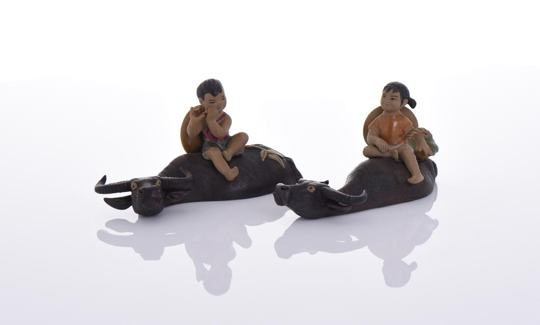 Two Glazed Clay Children Riding Water Buffalo (1 of 6)