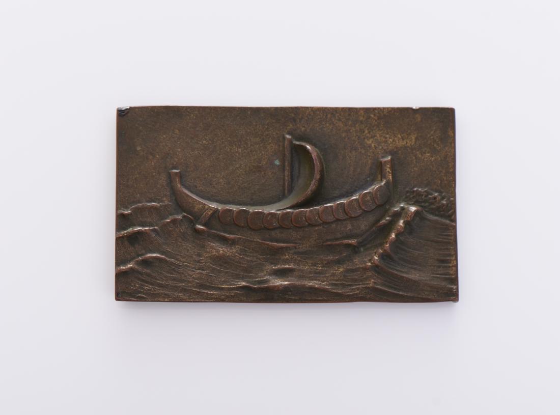 Bronze Plaque Of A Viking Ship At Sea.
