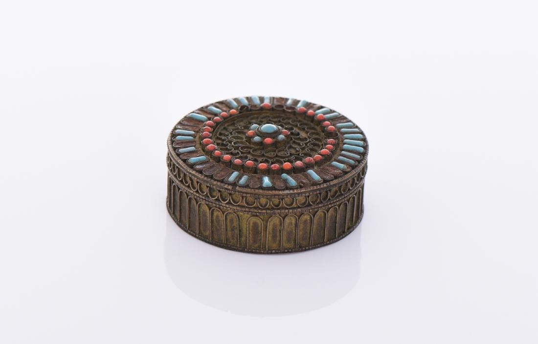 Tibetan Pill Box Decorated And Inlaid: Tibetan Pill Box Decorated And Inlaid With Turquoise And Red Coral Over Brass Filigree Design. Estimated more than 100 yrs old. Tibetan artists have played a key role in the cultural life of Tibet for