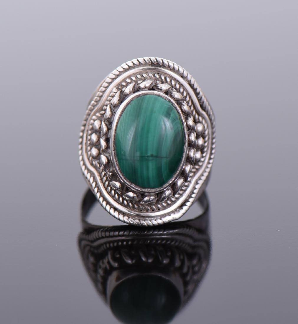 Malachite Sterling Silver Ring.: Malachite Sterling Silver Ring. Estimated less than 50 yrs old. 925 Sterling Silver consisting of 92.5% silver and 7.5% copper. Tested Positive using Nitric Acid Chemical Scratch Test, Cloth Rub Test,
