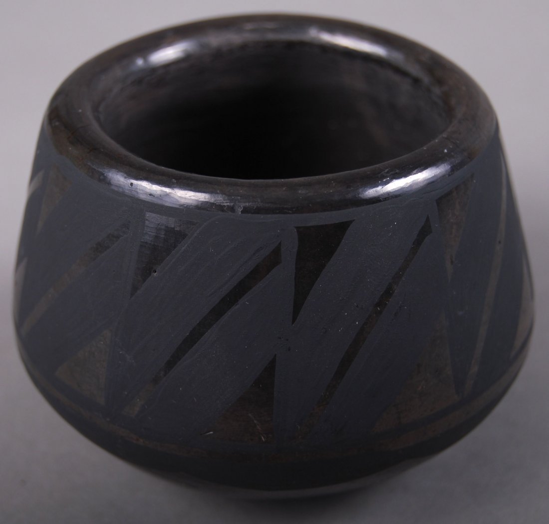 Black on Black Pottery signed JM SOP (Wider at Bottom): Black on Black Pottery signed JM SOP (Wider at Bottom) [Height/Length (in)= 2.75, Width (in)=3.5, Depth (in)=3.5, Weight (lbs)=0.5] With C.O.A. signed by Chief Joe Dan Osceola & Seminole Tribe.