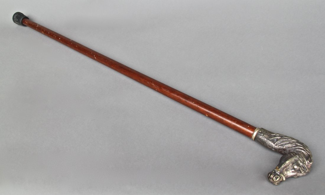 Horse Head Cane signed "AM", dark brown shaft, Jewels: Horse Head Cane signed "AM", dark brown shaft, Jewels in Eyes [Height/Length (in)= 35, Width (in)=4, Depth (in)=1.25, Weight (lbs)=1] With Pangaea Auctions C.O.A.