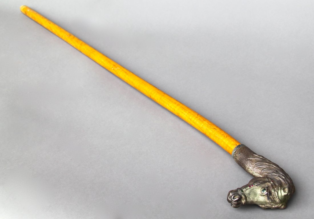Horse Head Cane signed "AM", light brown shaft, Jewels: Horse Head Cane signed "AM", light brown shaft, Jewels [Height/Length (in)= 36, Width (in)=4, Depth (in)=1.25, Weight (lbs)=2] With Pangaea Auctions C.O.A.