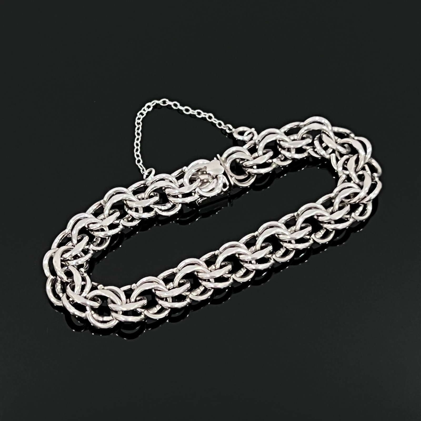 Bracelet: Elco Sterling Bracelet, Sterling Silver Tested (Stamped Sterling), 29 gram Length 7.75 inch. Estimated less than 50 years old. All photos represent the lot condition and may contain unseen imperfectio