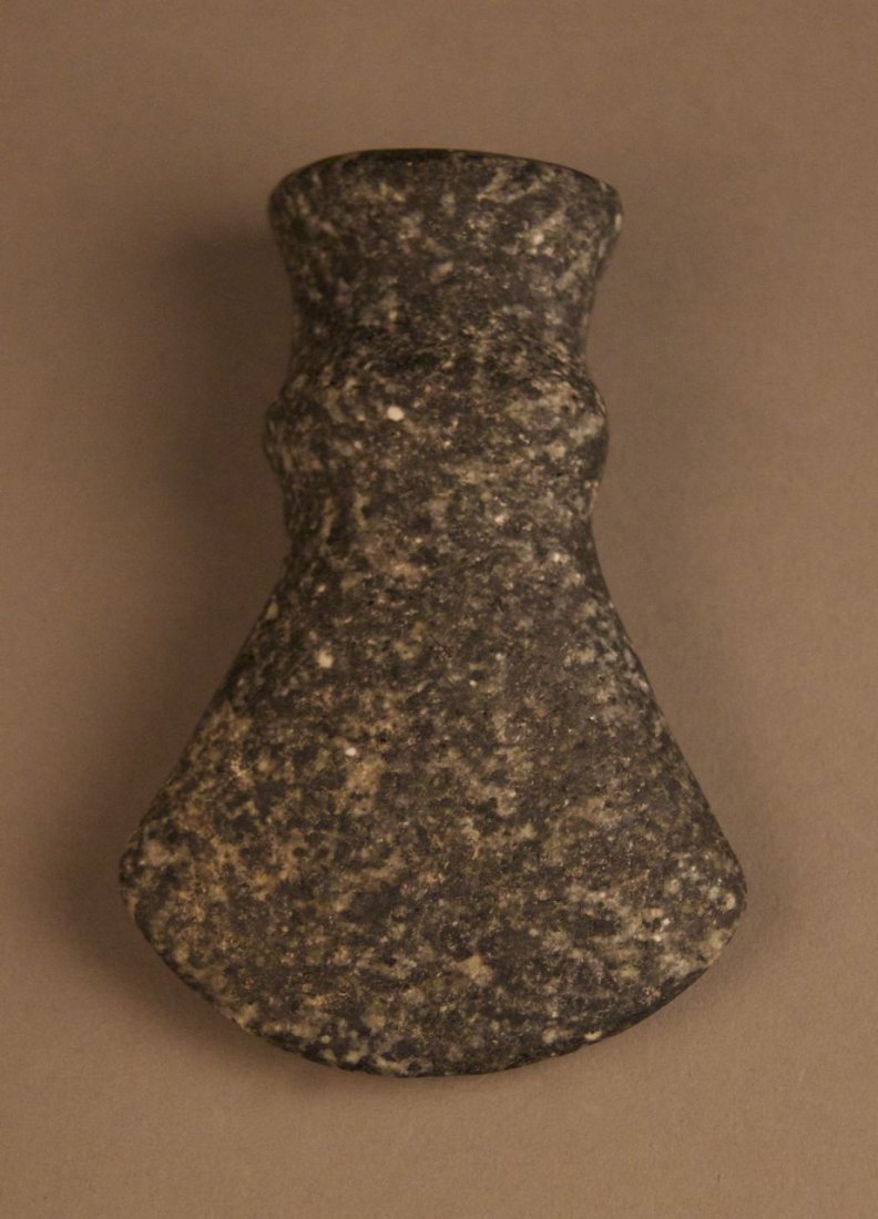 A fine and rare early Native American Artifact. A blac: A fine and rare early Native American Artifact. A black and white speckled granite hand held tool. Authentic and worn with original Certificate of Authenticity from previous owner, Chief Joe Dan Osceo