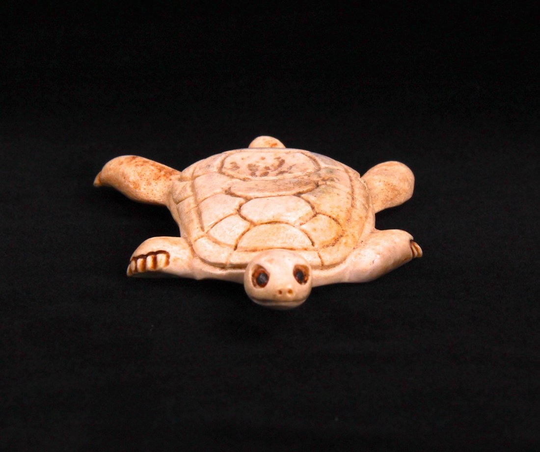 Stan Hill Carved Swimming Turtle. A fine carving from: Stan Hill Carved Swimming Turtle. A fine carving from bone. Stan Hill was a Native American carver know for intricate his carving of materials such as antler and bone. Signed on the bottom "Stan Hill