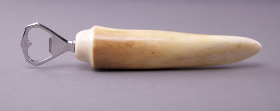 Rare Antique Ivory tusk bottle opener. Labeled "Inox: Rare Antique Ivory tusk bottle opener. Labeled "Inox France & Asprey London"(Size: See last photo for measurement.) Photos are part of the description representing the condition report. Pangaea Auctio