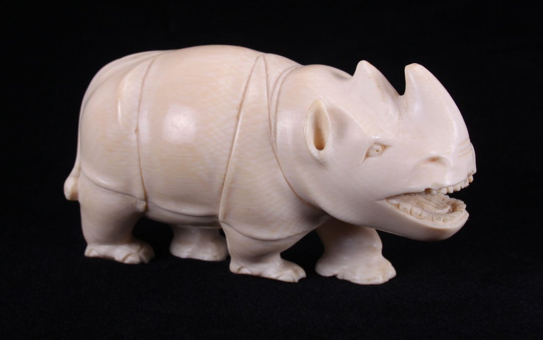 Early 20th Century, African ivory carving of a Armored: Early 20th Century, African ivory carving of a Armored Rhino. Ivory Species: Unknown. UNITED STATES SHIPPING ONLY, WILL NOT EXPORT. THIS LOT IS FOR SALE ONLY WITHIN THE UNITED STATES, AND WILL ONLY BE