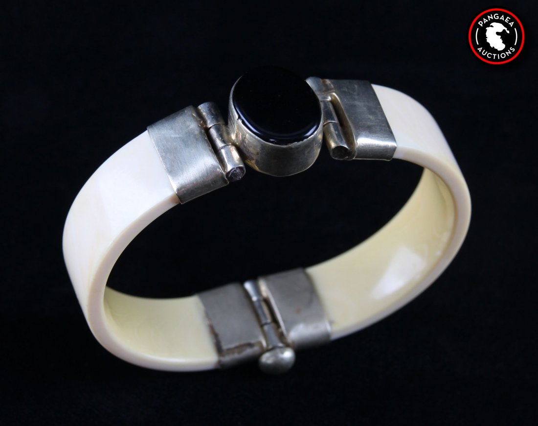 Antique sterling silver and ivory bracelet with black: Antique sterling silver and ivory bracelet with black onyx gemstone. SIZE: see attached ruler photo. Photos are part of the description representing the condition report and can be used for authentica