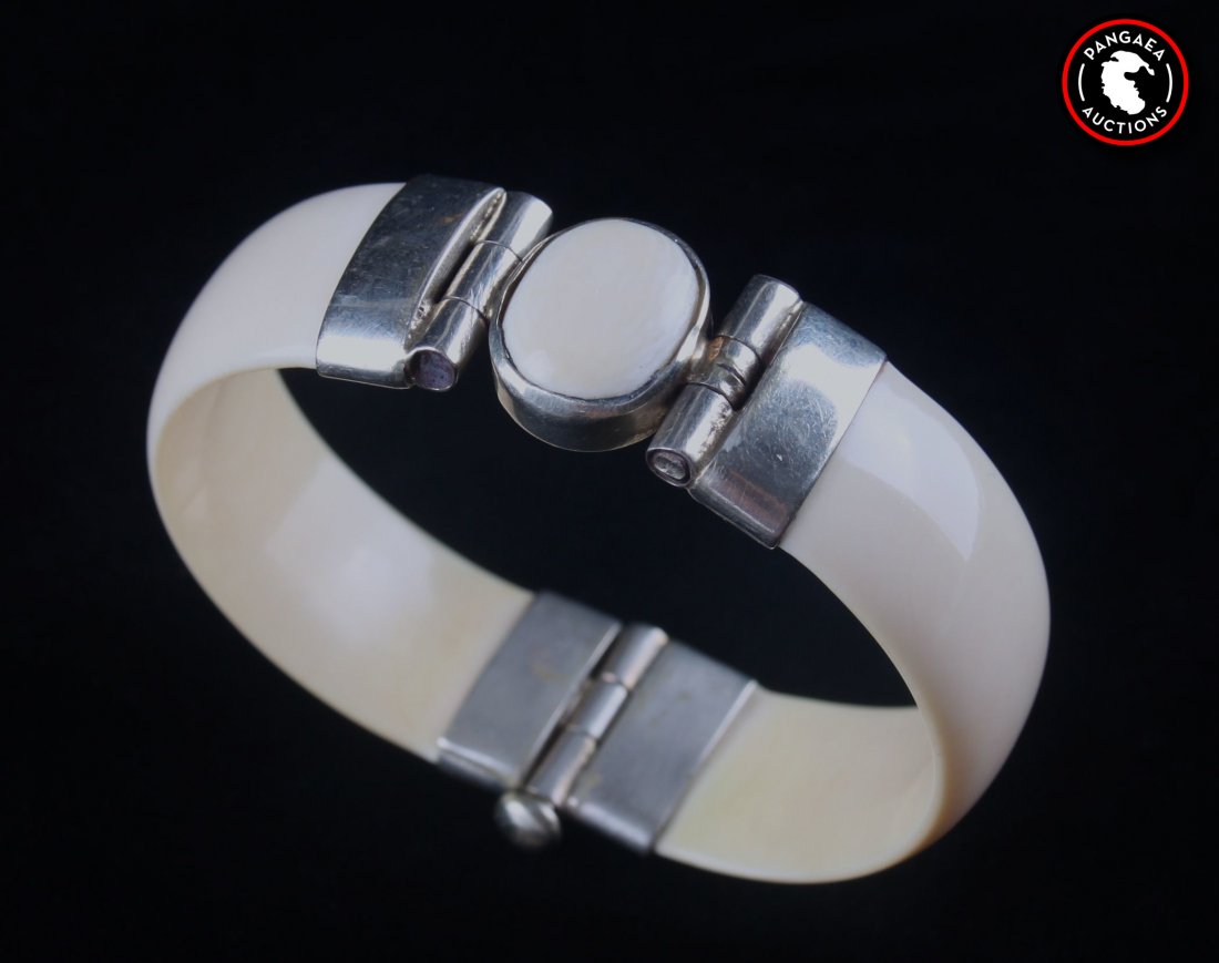 Antique sterling silver and ivory bracelet with ivory: Antique sterling silver and ivory bracelet with ivory charm. SIZE: see attached ruler photo. Photos are part of the description representing the condition report and can be used for authentication pri