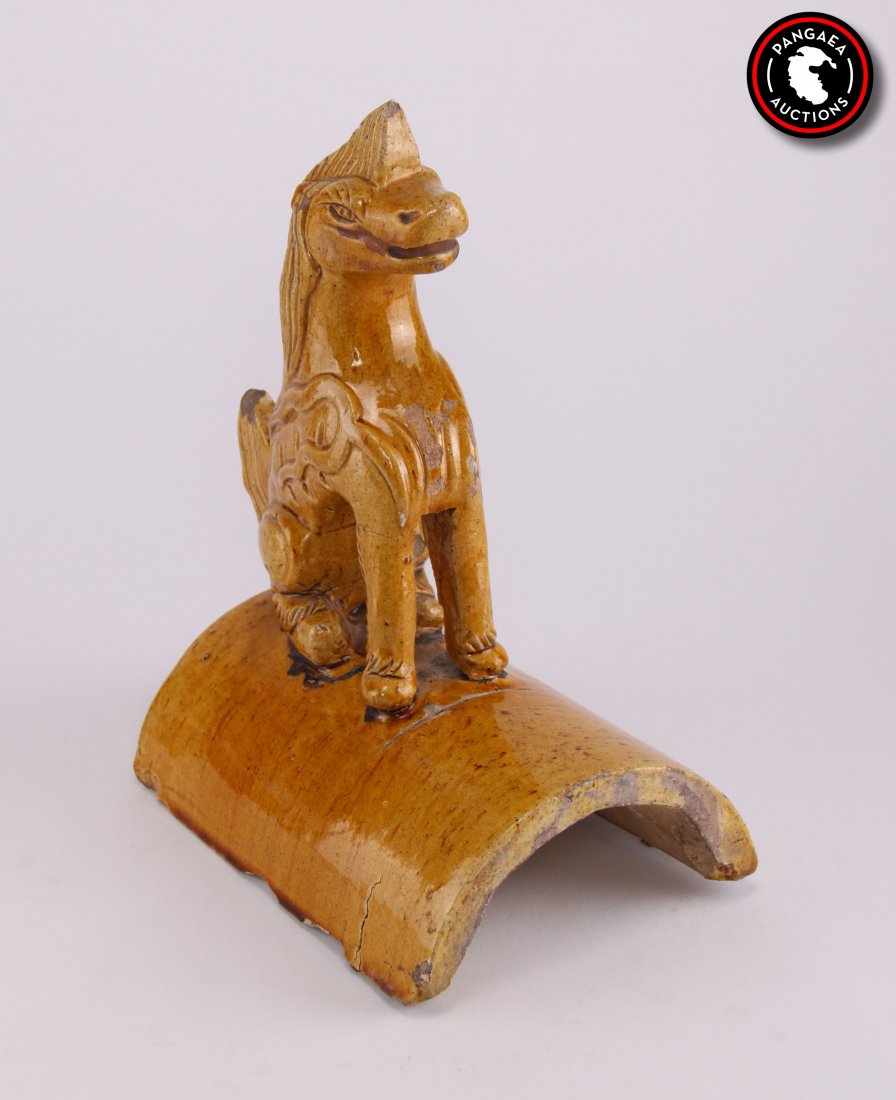 Chinese, Late 19th Century. Golden mustard glazed: Chinese, Late 19th Century. Golden mustard glazed ceramic seated foo dog or mythical guardian lions on curved roof tiles. SIZE: see attached ruler photo. Photos are part of the description representin