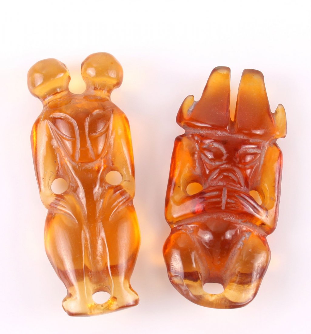 Two (2) carved amber figures in the form of a netsuke (1 of 5)