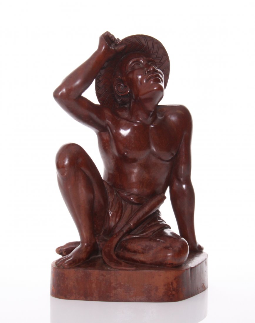 20th Century Balinese finely carved and polished hardwo: 20th Century Balinese finely carved and polished hardwood sculpture of a farmer gazing into the future. Realistic fine details throughout while tipping his hat and holstering his cropping tool. Carvin